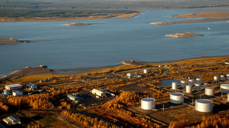 town along coast with large river in background